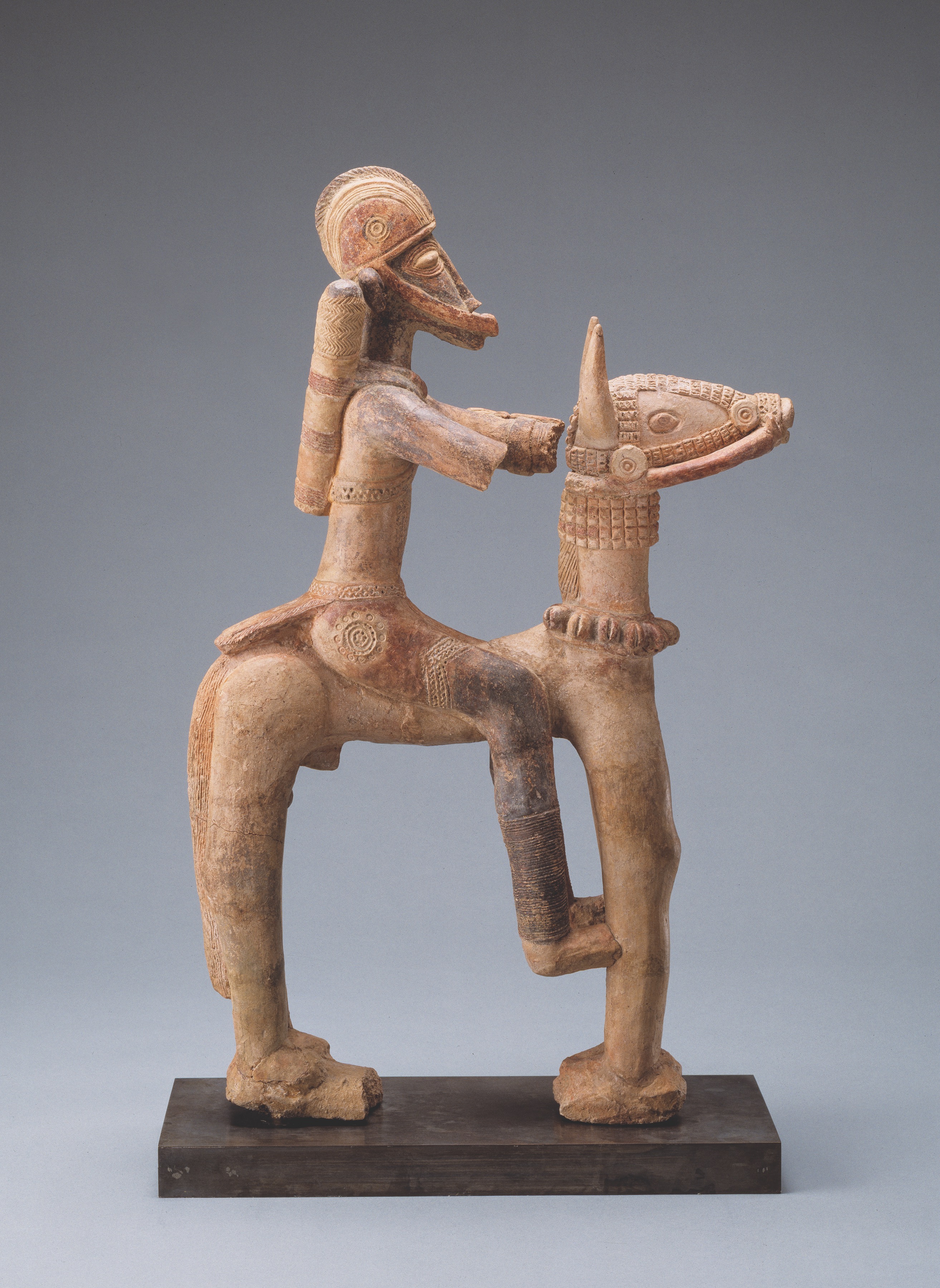 Sculpture of man sitting on a camel