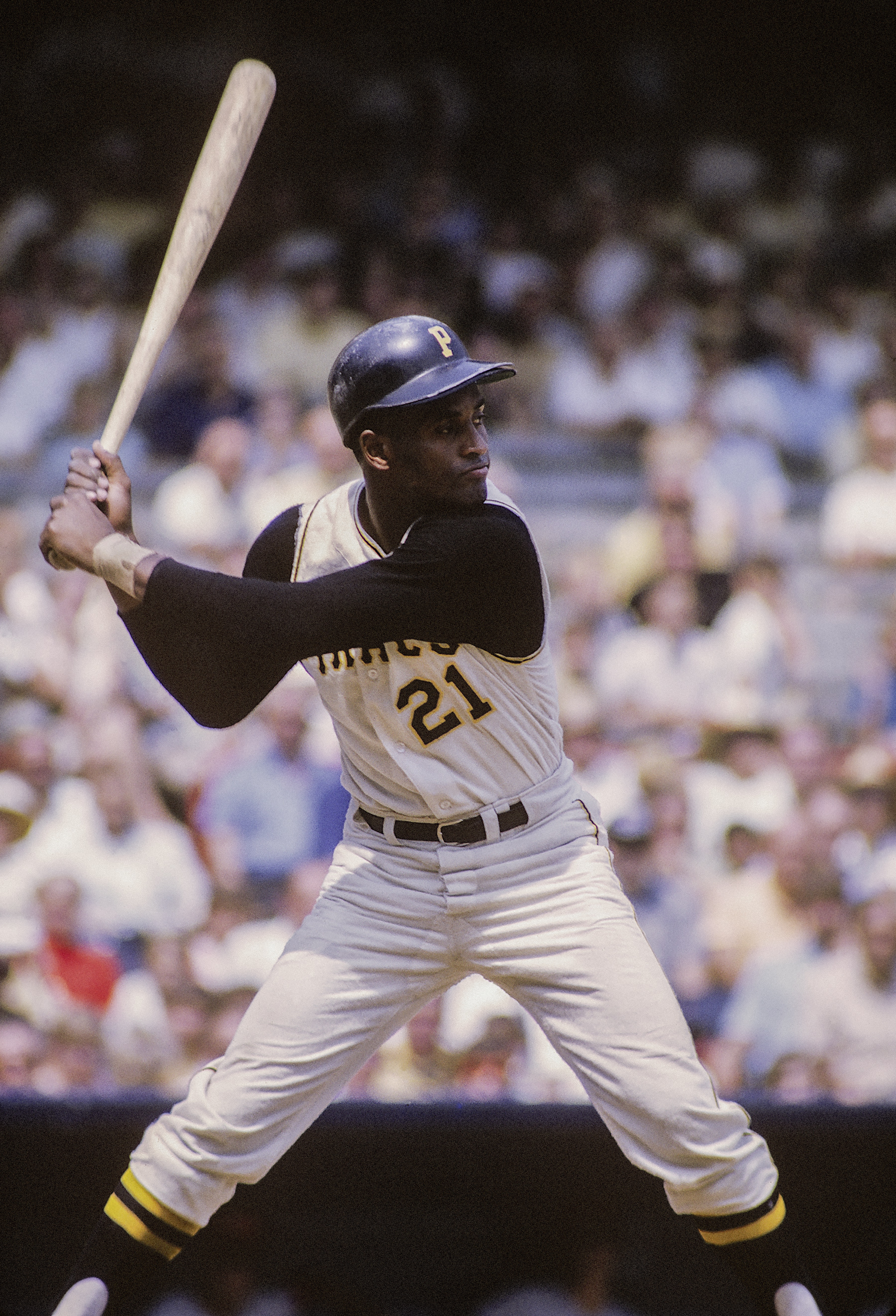 Baseball player swinging a baseball bat at a game