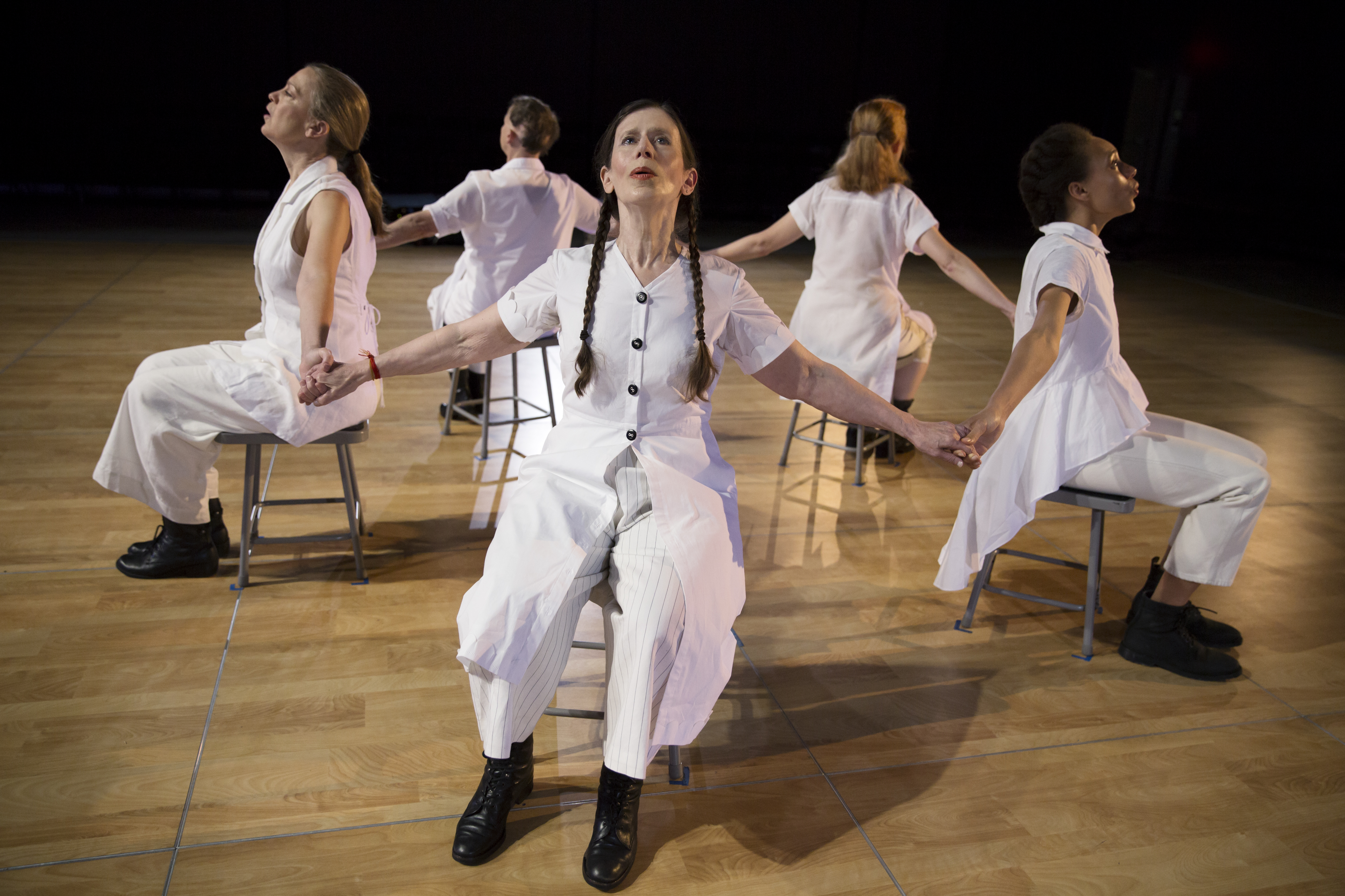 Women in chairs as performance art