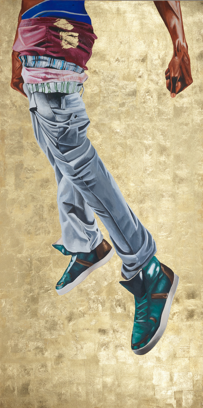 Painting of boys floating legs in a pair of jeans against a gold background.