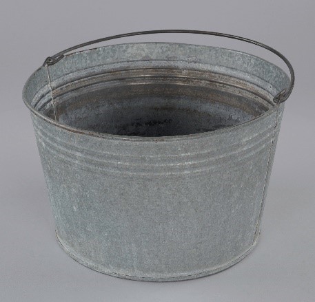 Photograph of silver pail with thin handle.