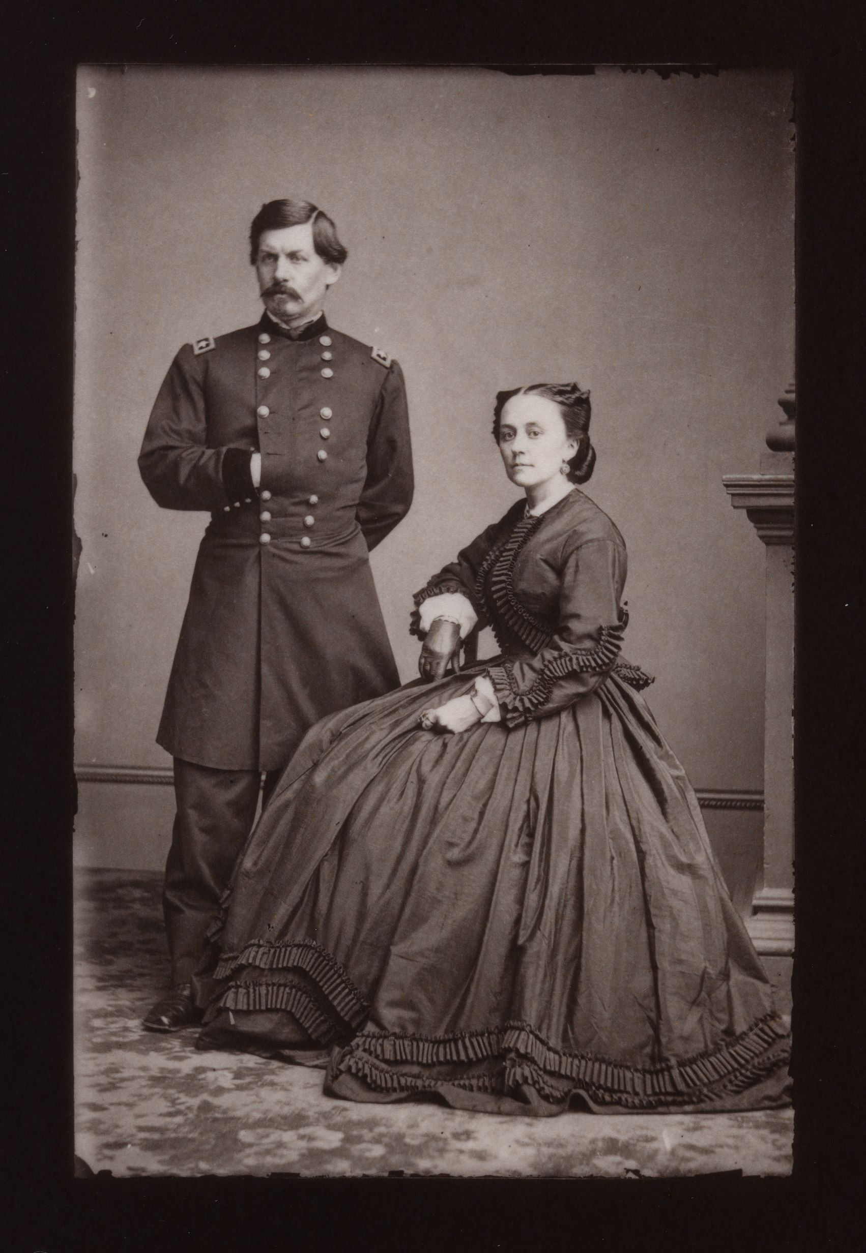 Antique photograph of a man and woman posed