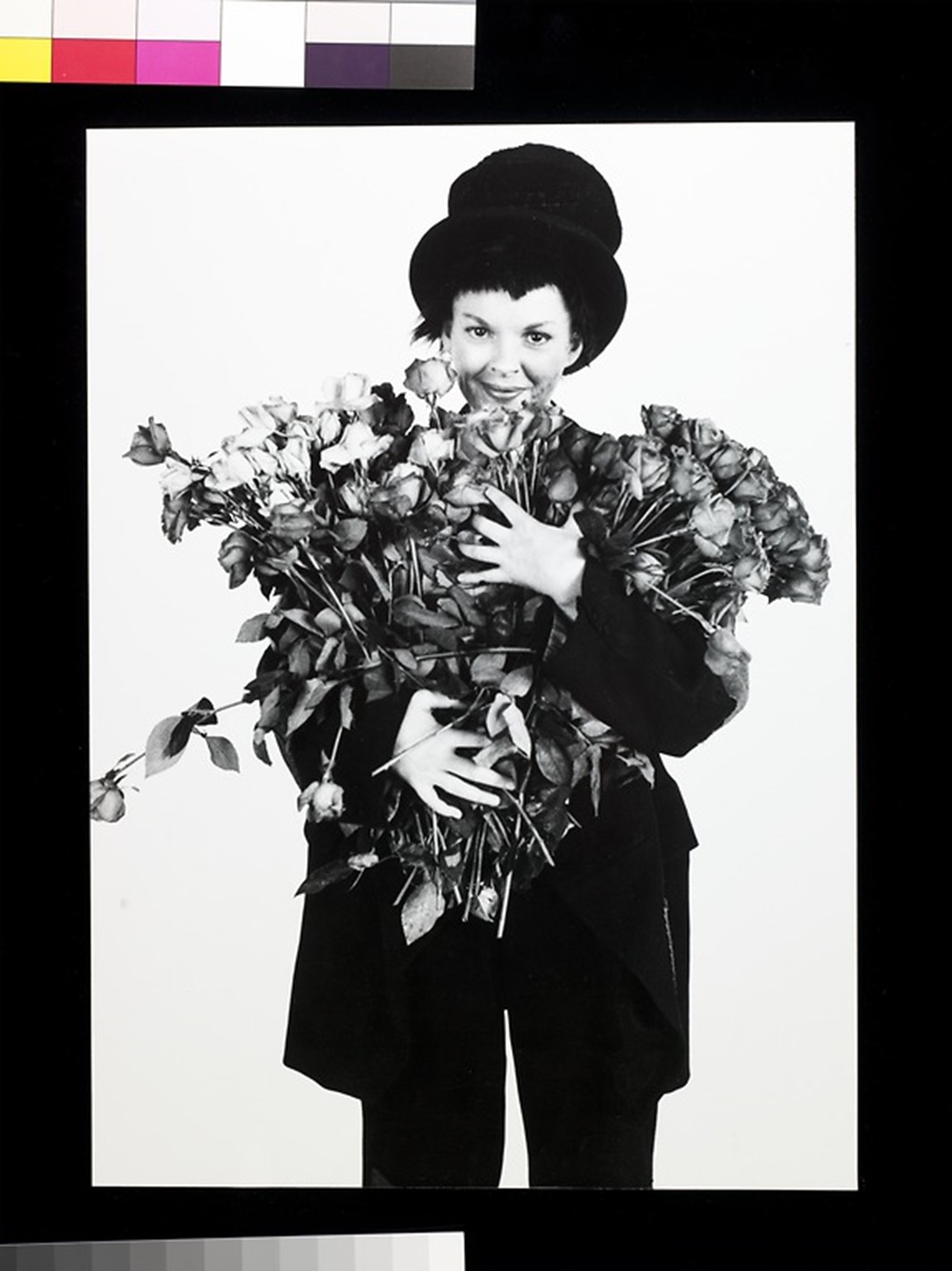 Black and white photo of a woman in top hat