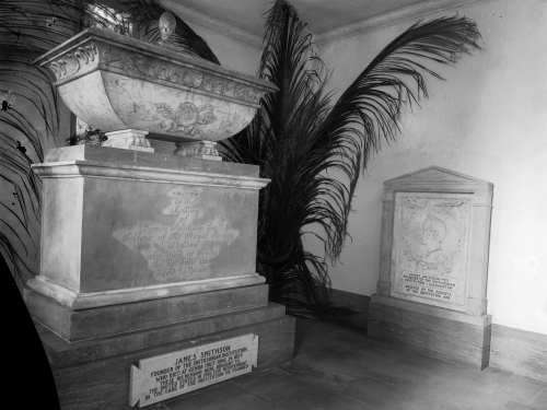 Large stone memorial with a grave marker next to it for James Smithson
