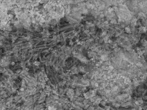 Microscopic close-up of grey textured surface