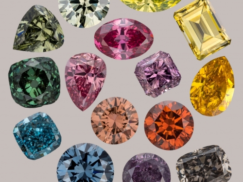 A spiral of diamonds, in a variety of colors and cuts, against a light background.