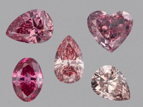 Five diamonds, ranging from light pink to dark pink, against a plain gray background.
