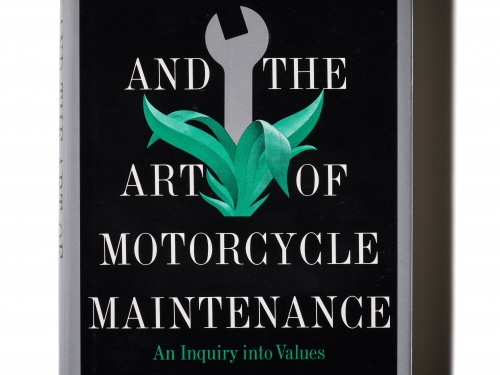 Book with black cover, graphic of wrench, and grey text.