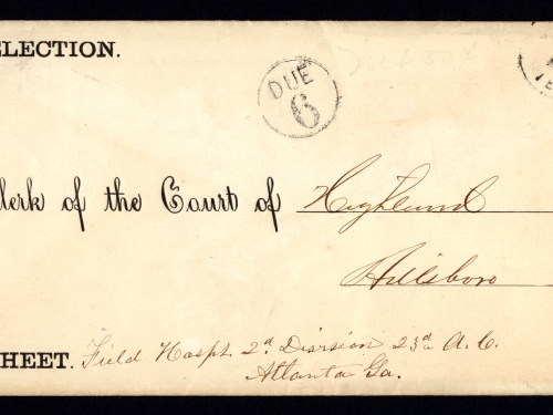 Envelope with printing, handwriting, postal marking, and postage stamp.