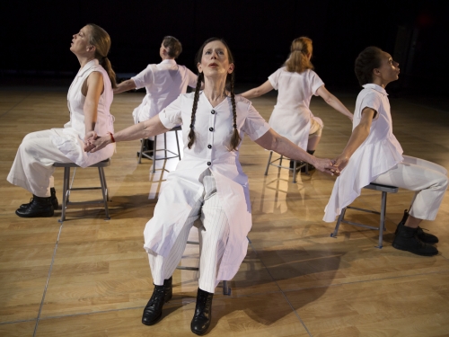 Women in chairs as performance art