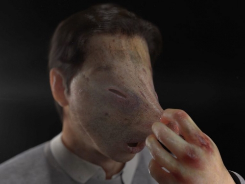 artwork showing man with plastic face