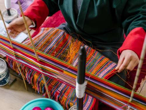 Close up of Bhutan weaver at work