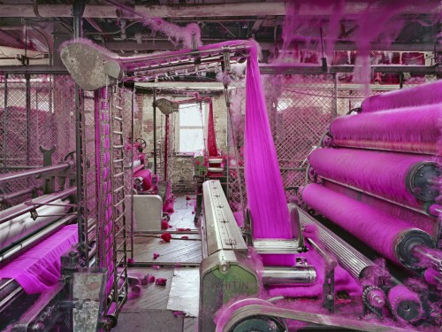 An industrial room with purple fabric.