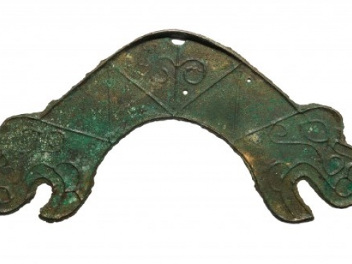 coin shaped like two dragon heads