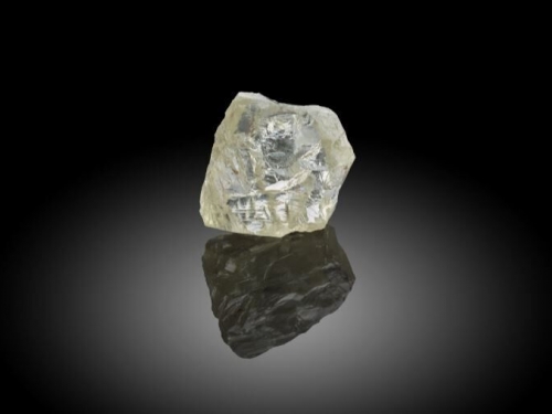 Uncut diamond on black background