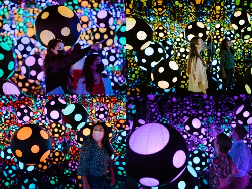 Room with mirrored walls filled with colorful polka-dotted balls