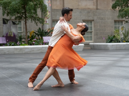 Two people dancing barefoot inside National Portrait Gallery
