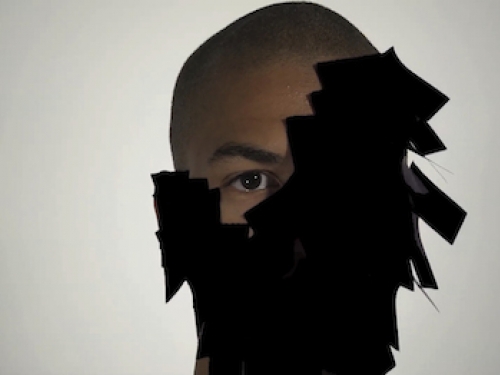 Man wearing stylized mask that covers half his face