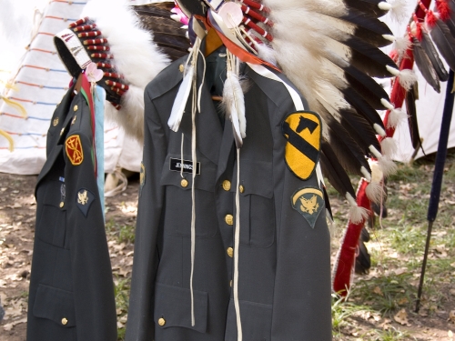 Military uniforms adorned with Feather headdresses