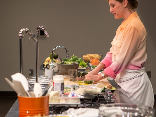Woman giving cooking demonstration