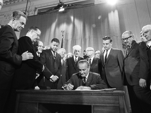 President Lyndon Johnson signs CIvil Rights Act of 1964