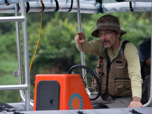 Man on boat pointing