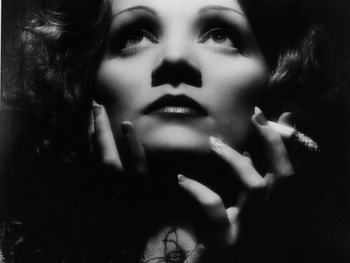 Black and white studio portrait of Marlene Dietrich as Shanghai Lily