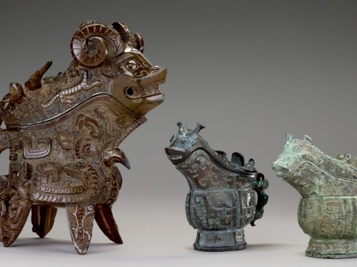 Three sculptural objects of varying ornateness depicting stylized animals