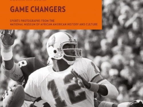 Cover of book with black and white image of football player about to throw a football.