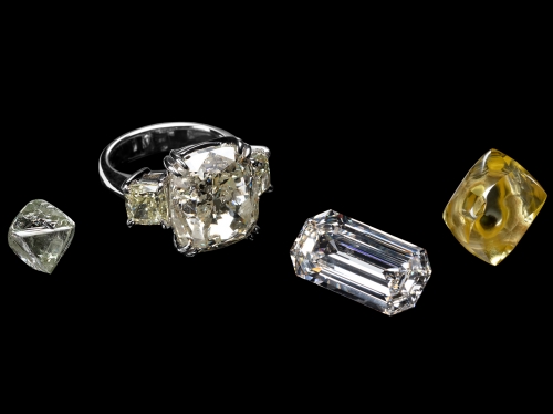 Four diamonds of various sizes on a blank background
