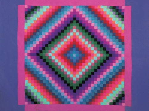 Vibrant quilt with abstract, square design