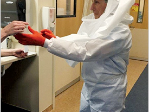 Dr Anthony Fauci in protective suit