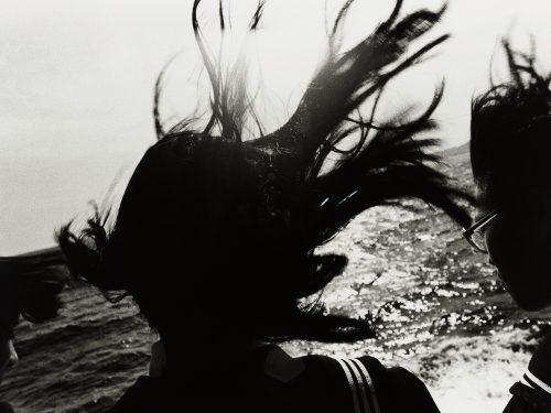 Black and white photo of girl in silhouette