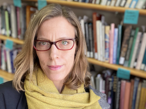 Headshot of woman in front of bookcase