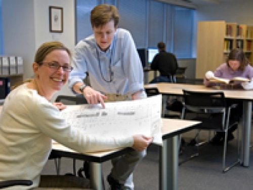 two people in an archive