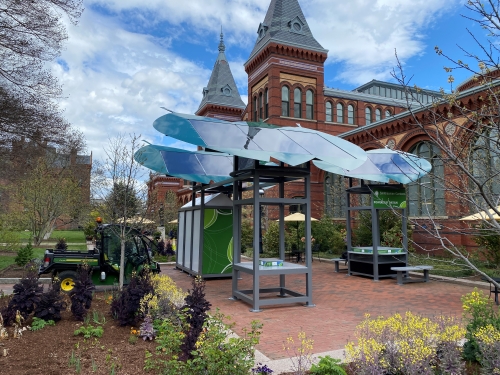 Outdoor garden with solar powered recharge stations in foreground