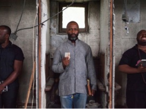 Promo photo of artist posed with two others