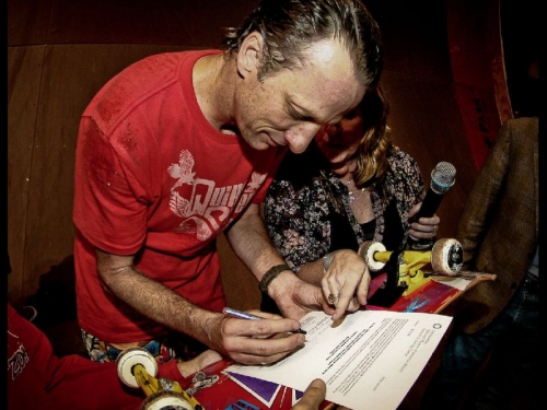 Tony Hawk signing a deed of gift