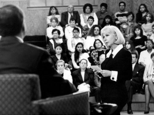 B&W photo of Saralegui interviewing guest in front of an audience