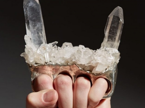 hand holding crystal devil horns