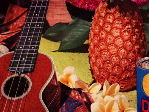 A ukulele framed by a pinapple.