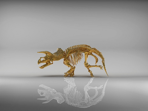 golden 3D-printed skeleton of triceratops with white reflection