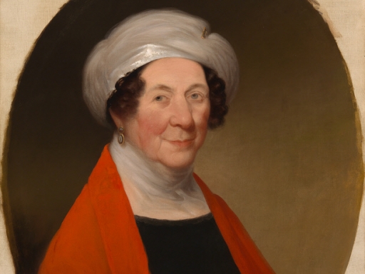Dolley Madison in turban with a black dress and a red shawl.