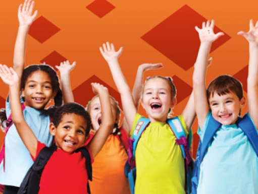 A group of young students cheer in excitement.