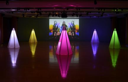 Art installation of neon tipis