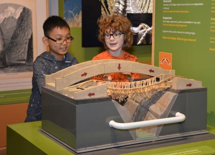 children playing with interactive toy table