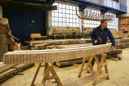 Man working on wooden boat