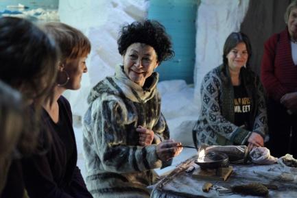 Click to view larger image Still from film Angry Inuk showing group of women talking