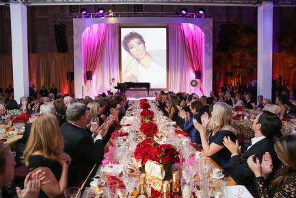 Attendees wating Aretha Franklin on screen