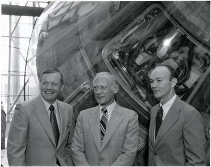 B&W photo of 3 astronauts with command module